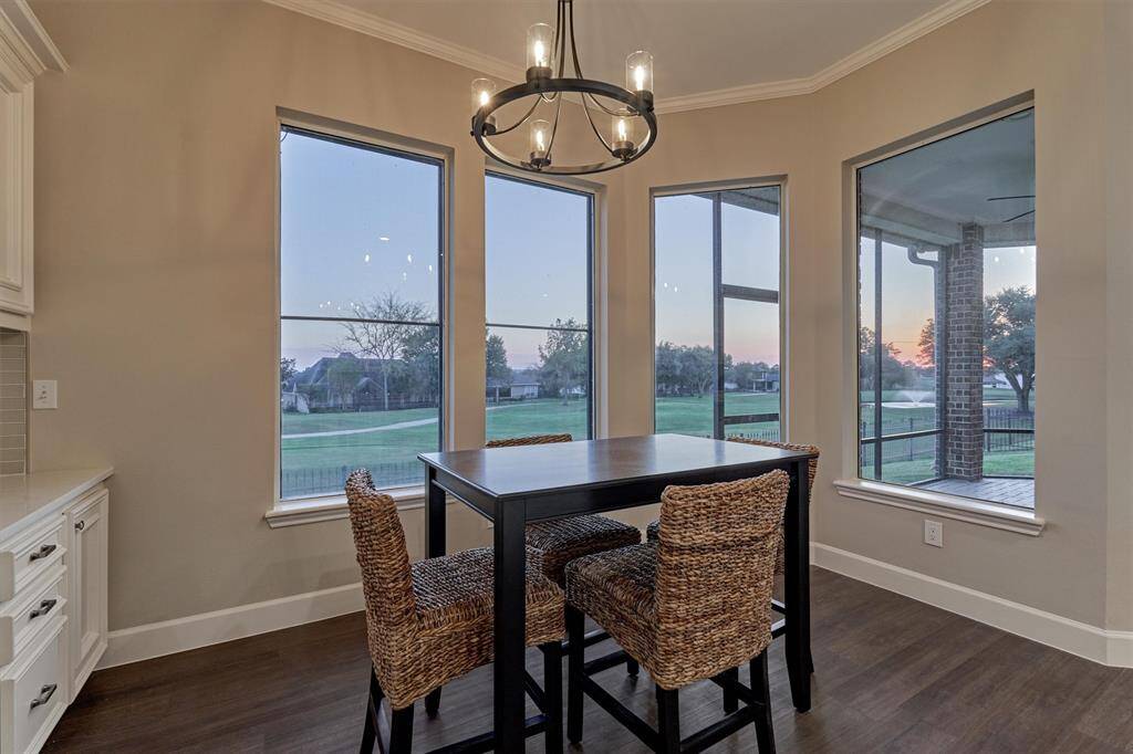 Enjoy your morning coffee admiring the peaceful views just outside your windows in this cozy breakfast area.