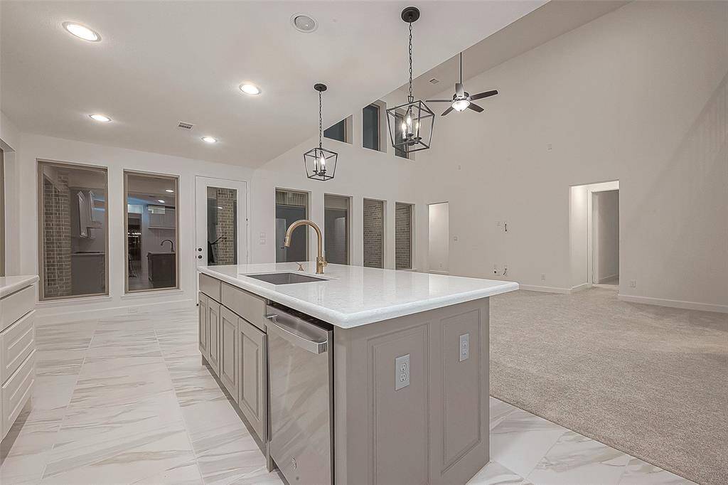 Adjacent to the kitchen, the breakfast area features large windows providing ample natural light.