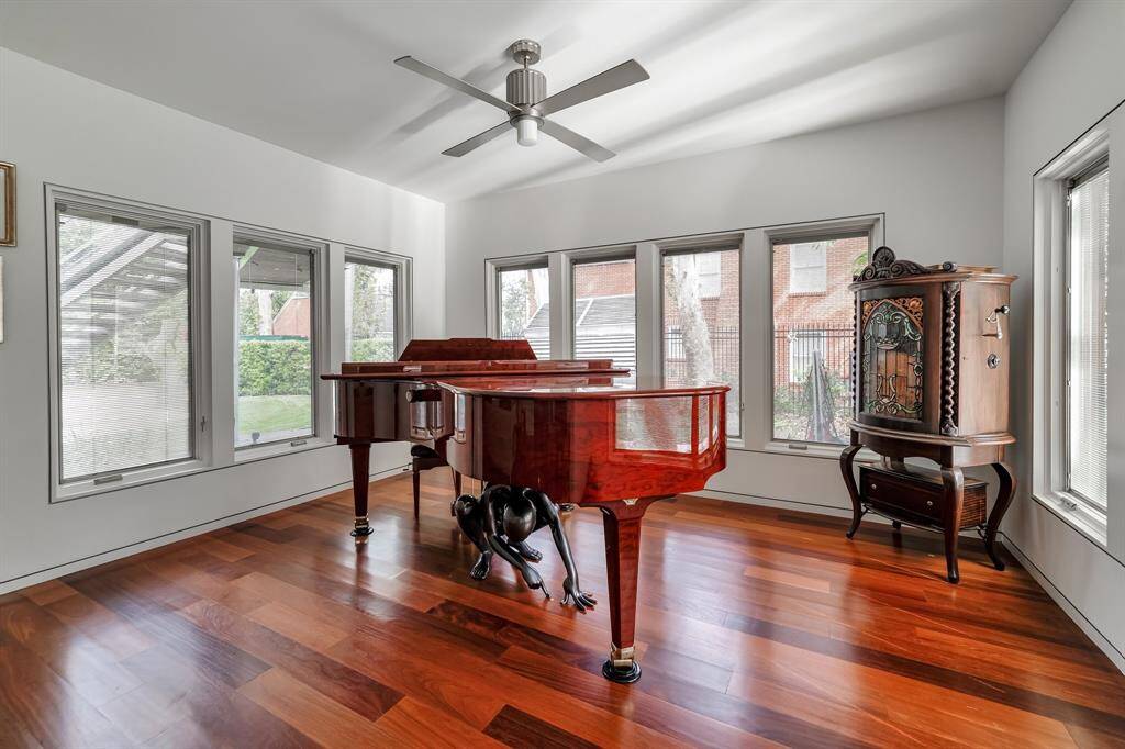 The light filled music room is just off the formal living area. Pella windows are operable and have blinds built-in.