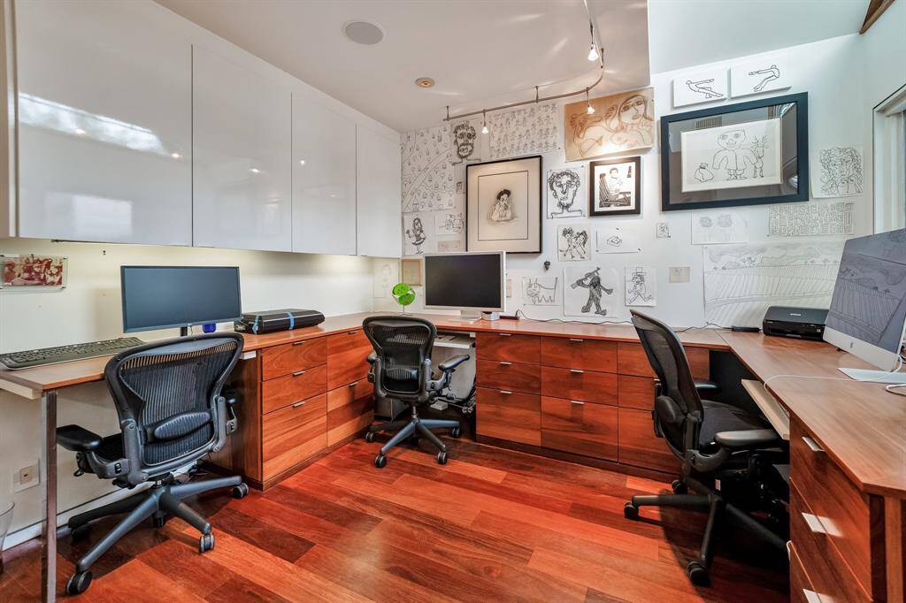 This thoughtfully designed workspace has space for 4 and the built-ins provide great functionality.