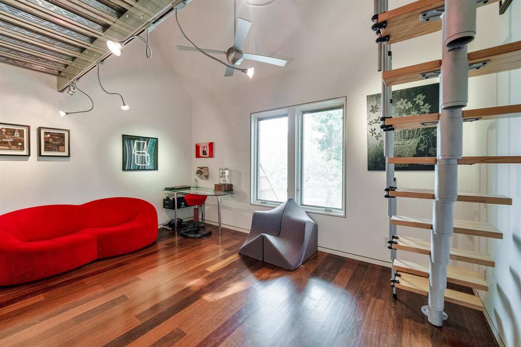 Bedroom #3 also has a contempory flair and a unique system of modern steps leading up to its loft above.