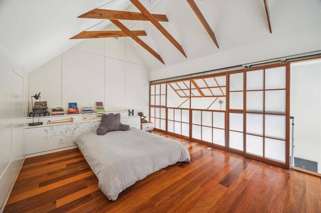 The loft above Bedroom #3 with Shoji screens made of thin white plexiglass.