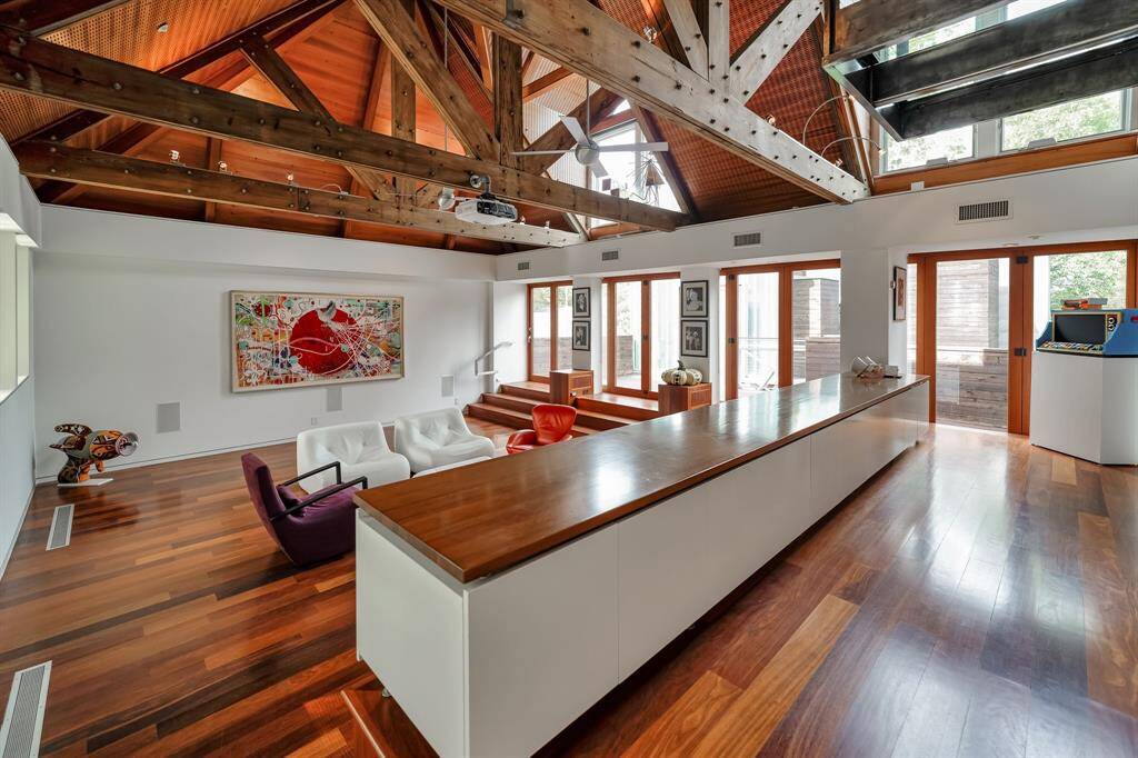 This room serves many purposes- media room, complete with projector and pull down screen, game room or a dance hall.