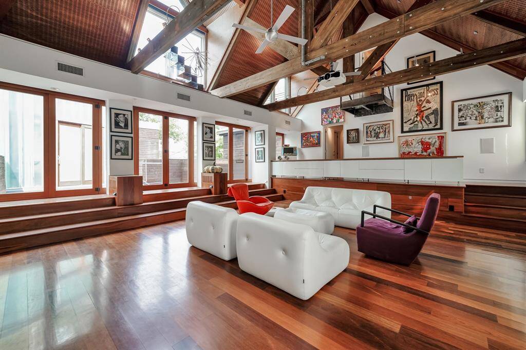 This media room was once an open air dance deck over the garage but has since been enclosed and air conditioned.