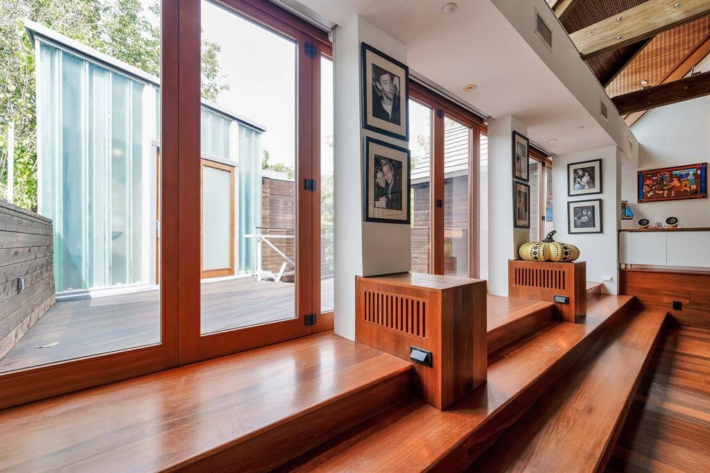 Accordion door opens up to bring the outside in on cool evenings. There is room for a small band to set up on the deck and the bathroom tower, complete with full bathrooms for costume changes.