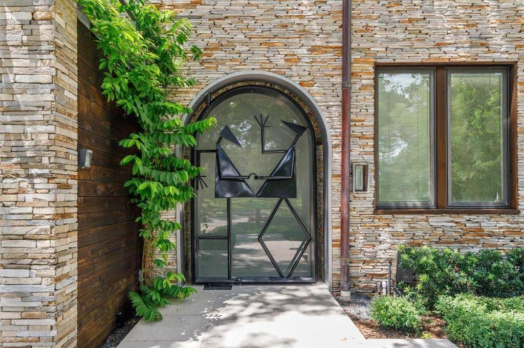 This custom door to the passageway opens with a code or a push of a button and closes automatically.