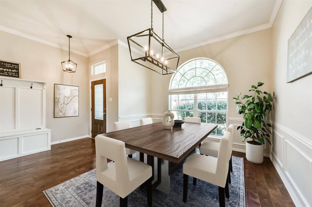 this photo is virtually staged, the dining room is currently being used as a playroom