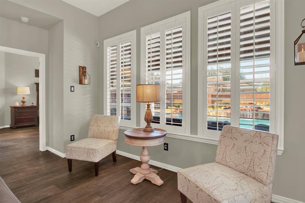 The living area looks out into the beautiful backyard.