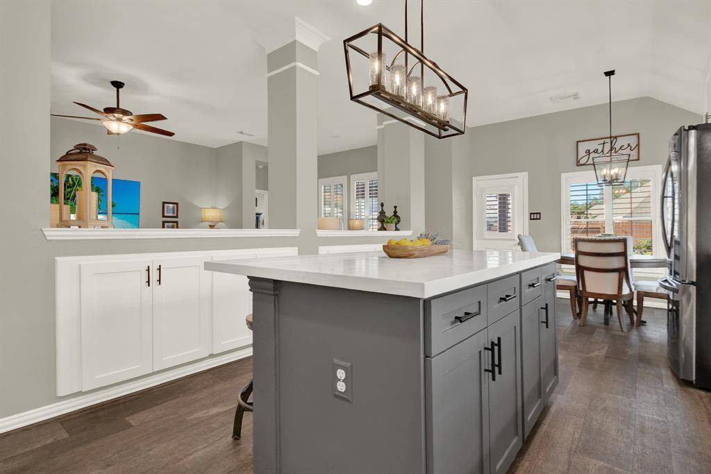Open-concept kitchen with an island and bar seating.