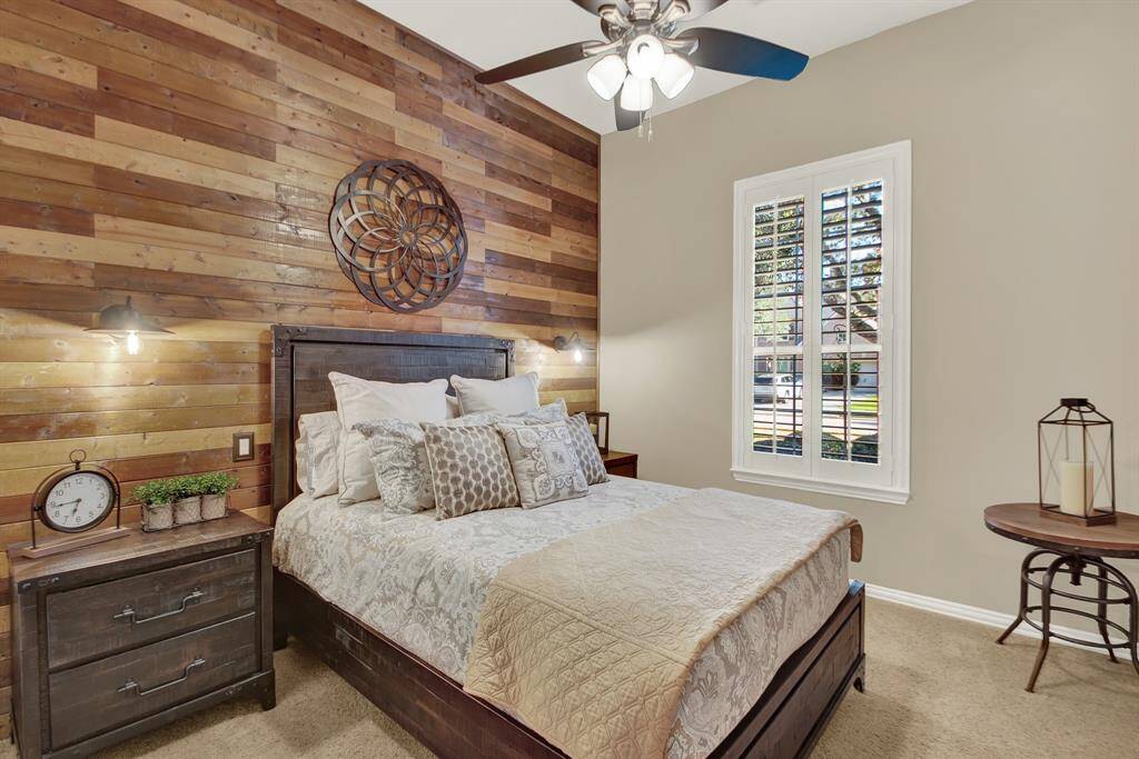 Rustic wood accent wall in this 3rd secondary bedroom.