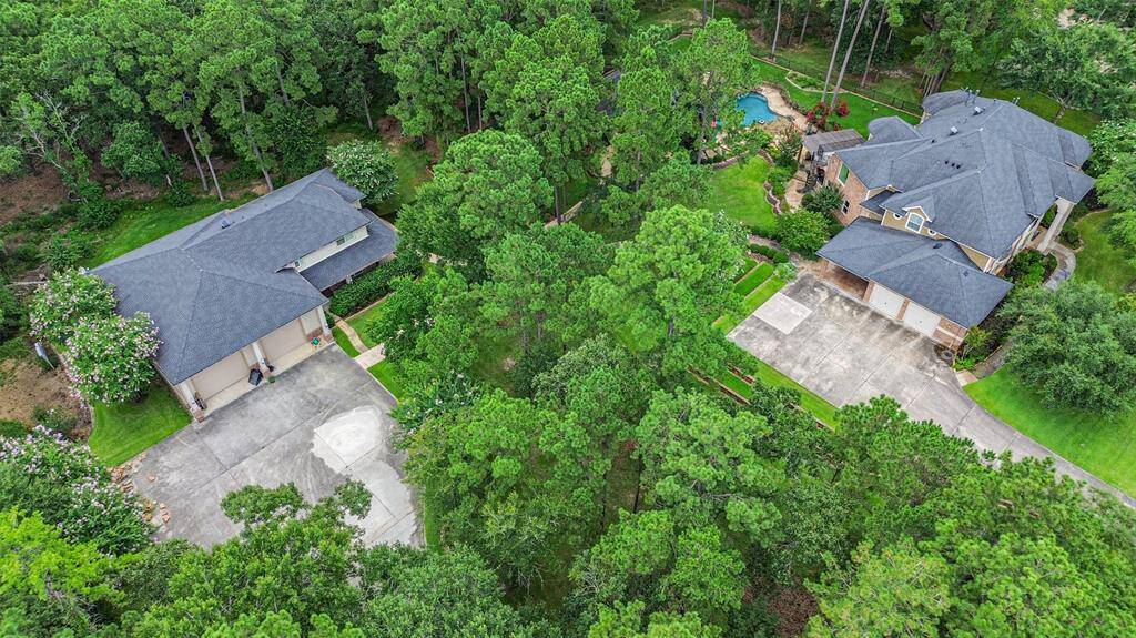 The 4 acre property consists of a main house (5700 sqft), a double RV garage with a first floor ADA compliant guest suite and second floor guest suite and a covered outdoor pavilion for alfresco dining by the pool. All three structures have a recent roof (2019).