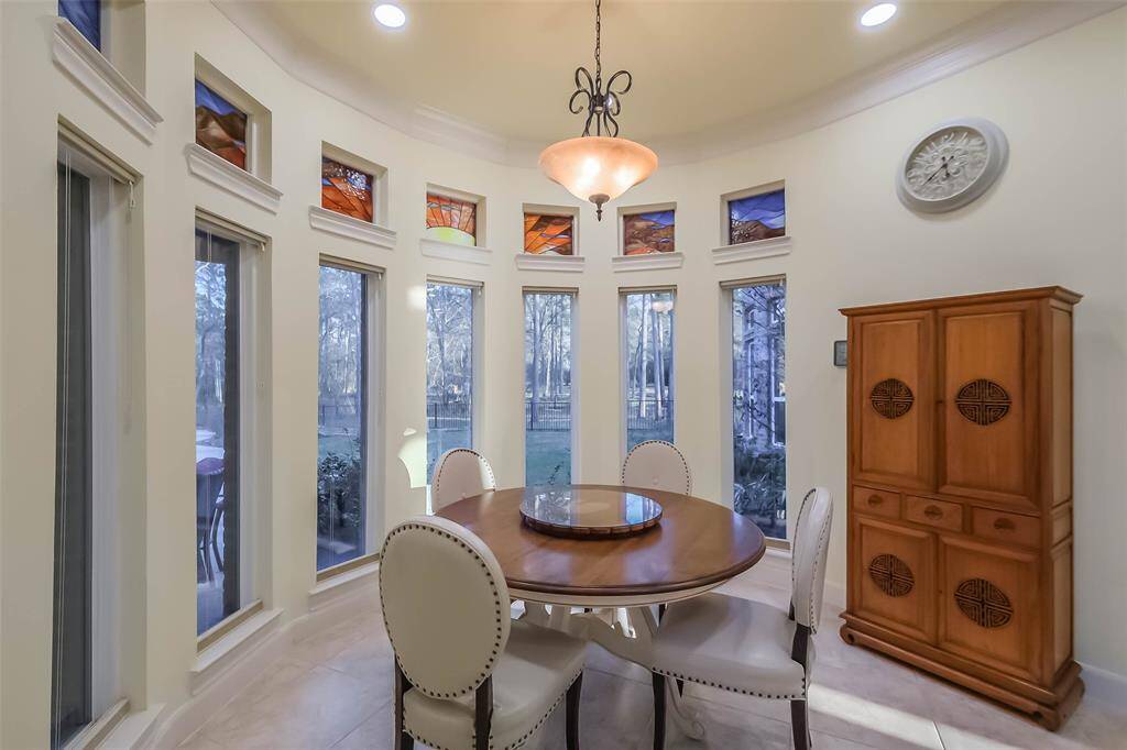 The circular breakfast room features floor to ceiling windows overlooking your amazing and private back yard.