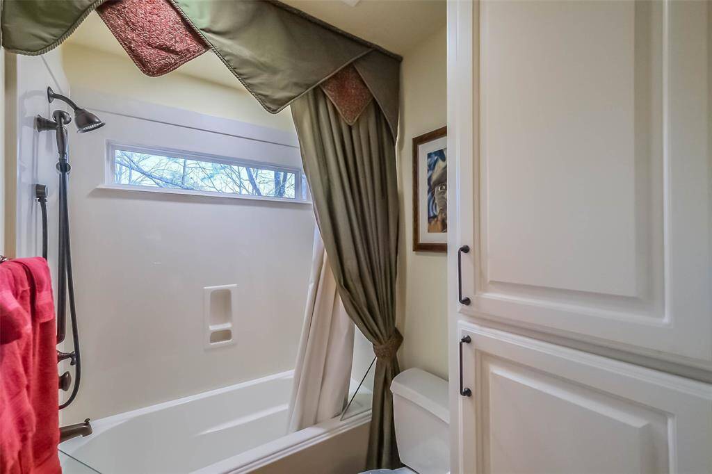Hollywood bath shower area with lots of storage