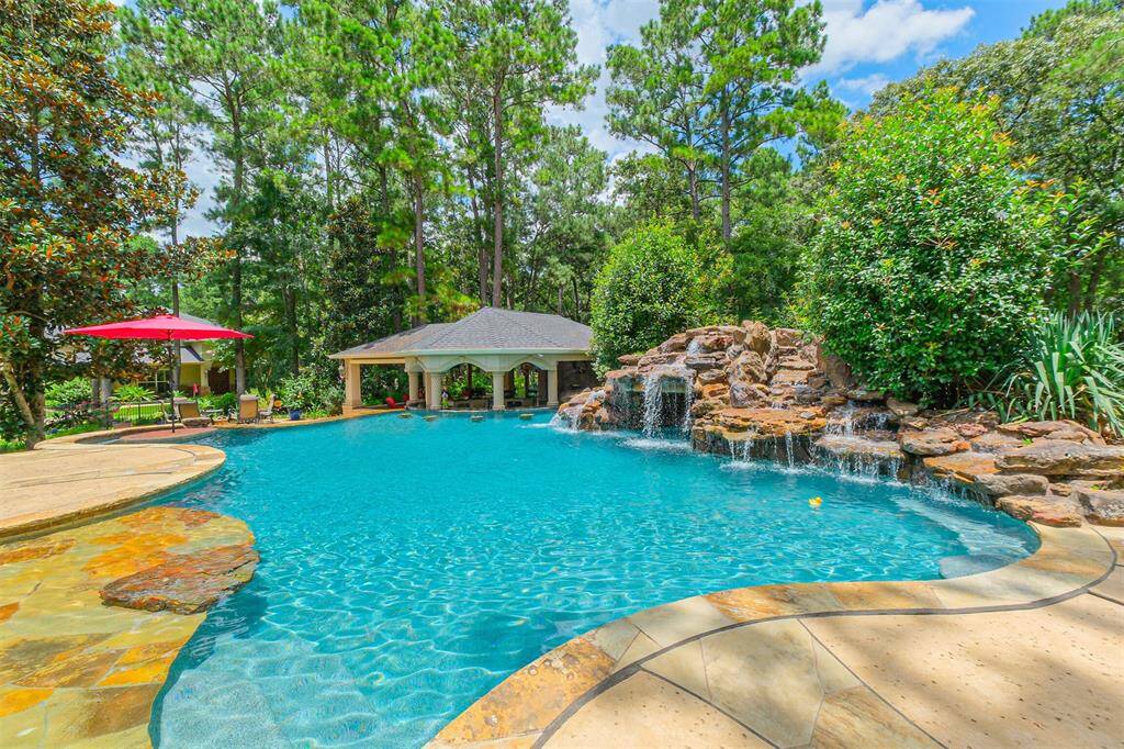 View of the in-pool bar and the beautiful surrounding landscaping providing tranquility and privacy.