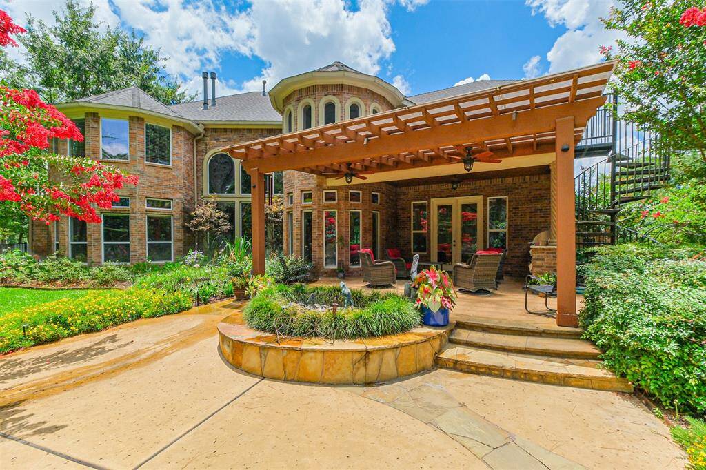 This covered dining area attached to the main house is perfect for an intimate weeknight alfresco dinner. The outdoor kitchen with gas grill is convenient and the surround sound speakers allow you to enjoy the music outside.