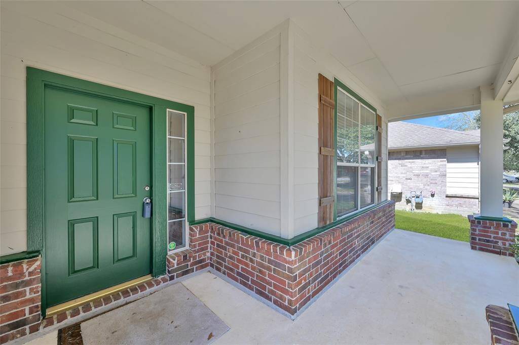 Charming two-story home with a combination of brick and siding exterior. It features a welcoming front porch, a two-car garage and a front yard with mature trees. Ideal for family living.