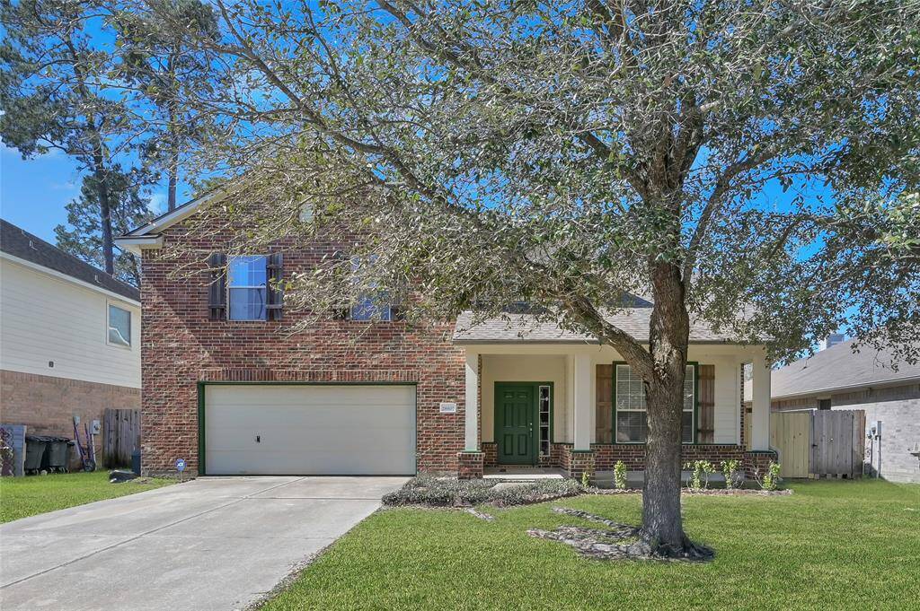 Another image of this stunning home showing the gorgeous tree which will give your front porch the shade you need on those hot summer days while you enjoy your visiting ducks.