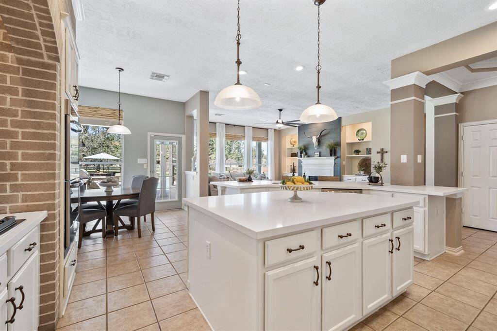 Storage is abundant in this home Kitchen. This spacious island boasts closed storage on both sides, providing a convenient location for those frequently used Kitchen gadgets. The island also possesses two outlets, making this a great spot to house the standup mixer for cookie baking!