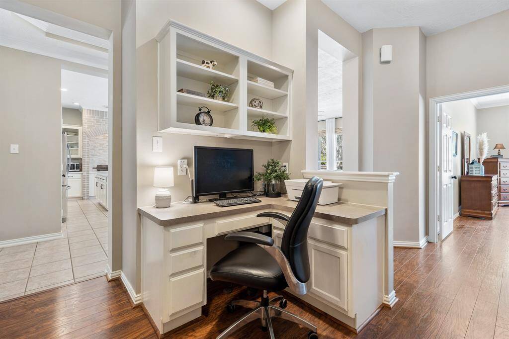This built-in desk is positioned between the Primary Bedroom and Secondary wing. Equipped with an abundance of storage and overhead lighting, this is the perfect place to keep the family calendar and tackle homework.