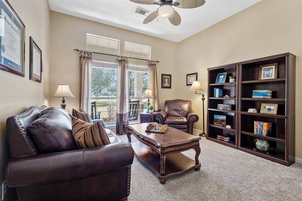 Located off the Secondary wing of the home sits this bonus room, equipped with wall-to-wall plush carpeting, ceiling fan, closet, and windows overlooking the Front Porch. This space can function as a 4th Bedroom, Home Office, Workout Room, or whatever you wish.