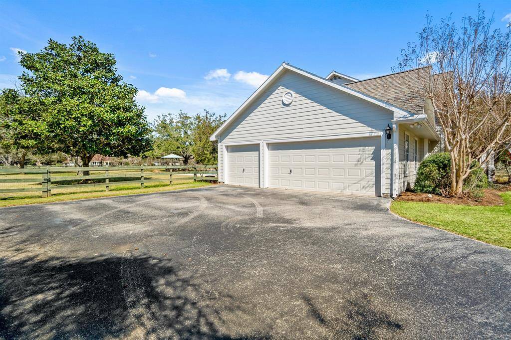 The oversized driveway leads to an attached, 3-Car Garage that has finished epoxy flooring and plenty of room for storage. The driveway extension provides room for additional parking when entertaining, as well as the perfect place to safely shoot hoops or ride bikes.