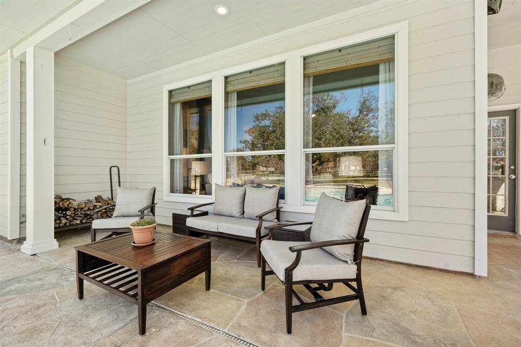 The Covered Back Porch wraps around and provides additional outdoor living space. Safe and protected from the sun, this area can function as a cozy outdoor sitting area or dining area with a view.