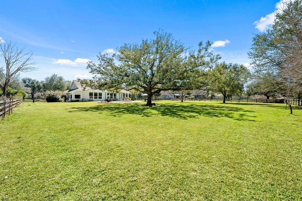 The entire Backyard is fenced and equipped with chicken wire for added protection. Large trees provide a dappling of shade across the property, while still having plenty of space to run and play. Or, hop on the neighborhood trails directly behind.