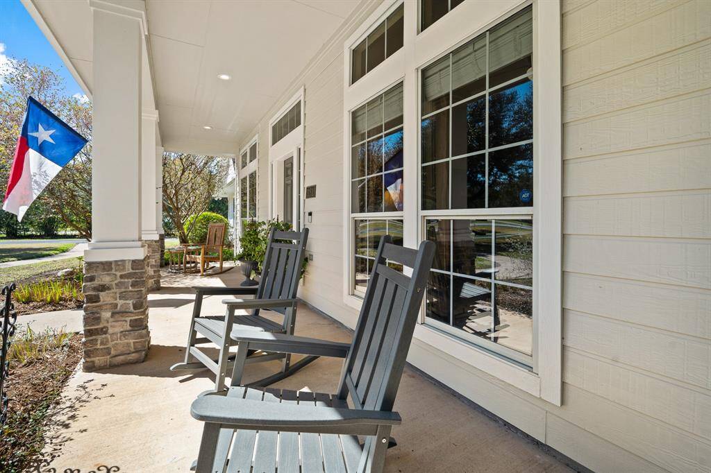 Time slows down while sipping a glass of sweet tea from the comfort of a rocking chair on this southern-inspired, Front Porch! The space boasts recessed lighting, an extended awning, and stacked stone pillars.