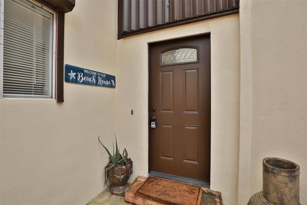 Front door tucked behind the gated garden.