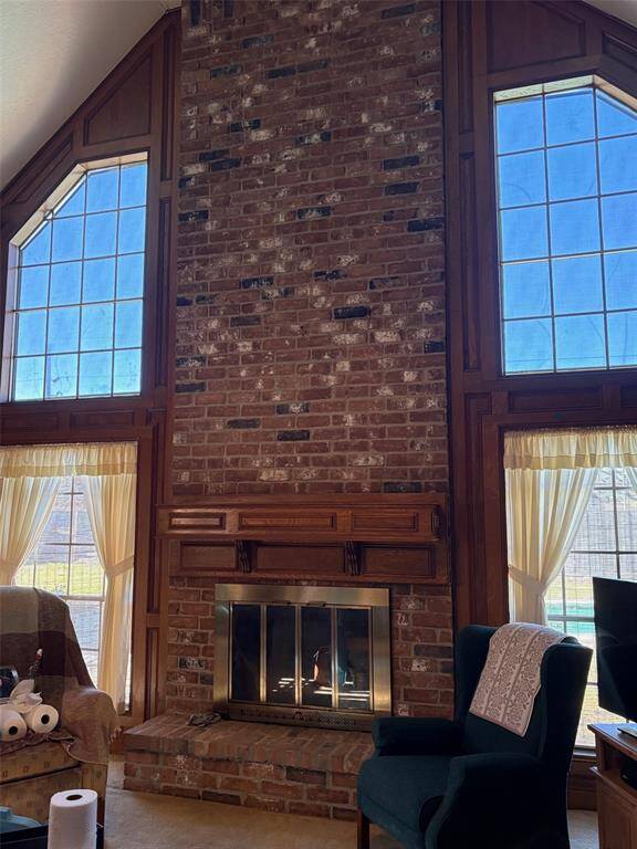 High ceiling and brick fireplace