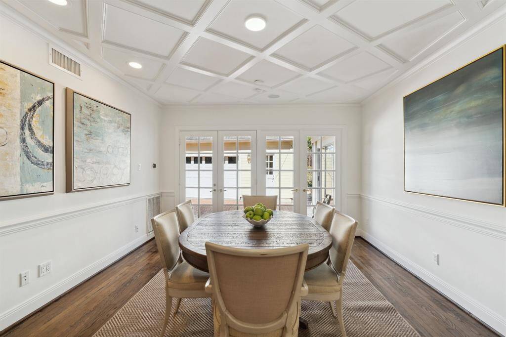 This is a delightful, well-illuminated space for sharing meals with family and friends. The ceiling treatment is a diagonal trellis design. There is marvelous millwork throughout this exceptional residence in River Oaks.