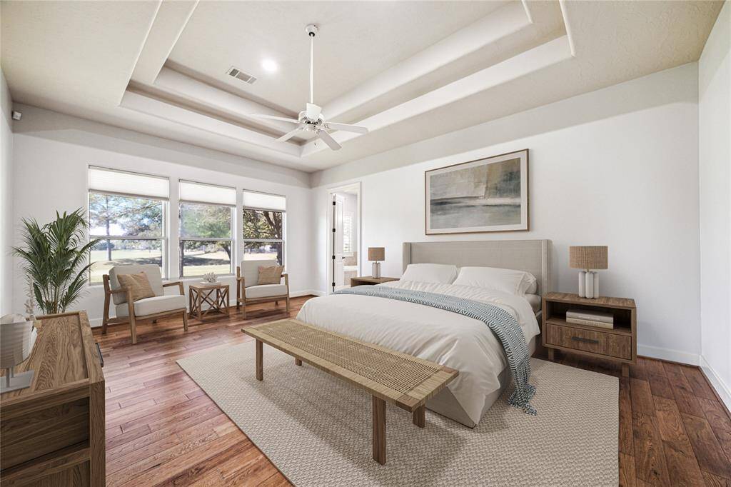 Another option for staging this spacious primary bedroom with abundant natural light and serene views. *Virtually Staged*