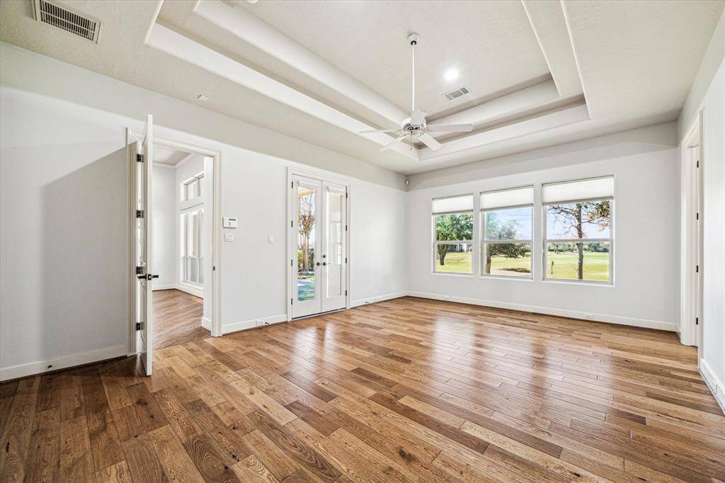 Overlooking the golf course adds picturesque views, perfect for relaxing. En-suite bathroom and exclusive patio access are fantastic features to this delightful primary bedroom.