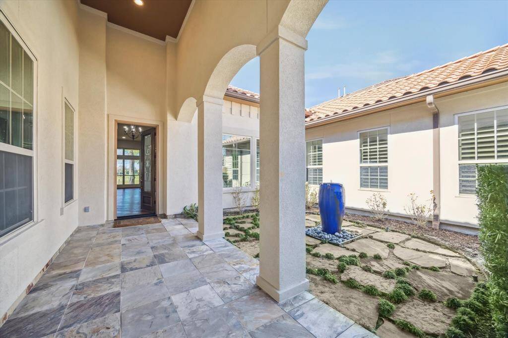 Discover tranquility and privacy in the exterior courtyard, featuring a stunning fountain that creates a soothing ambiance.