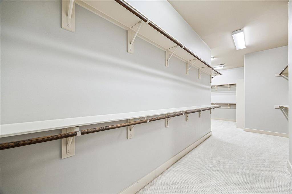 Opposite view of the expansive primary closet with endless storage.