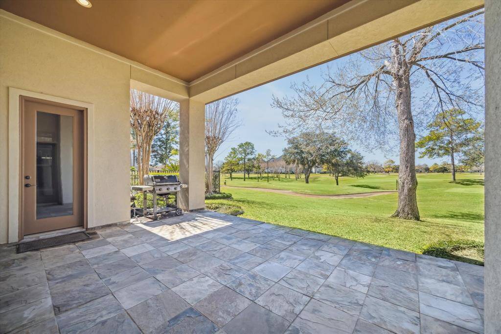 This charming outdoor patio has doors providing easy access to the breakfast room or primary bedroom.