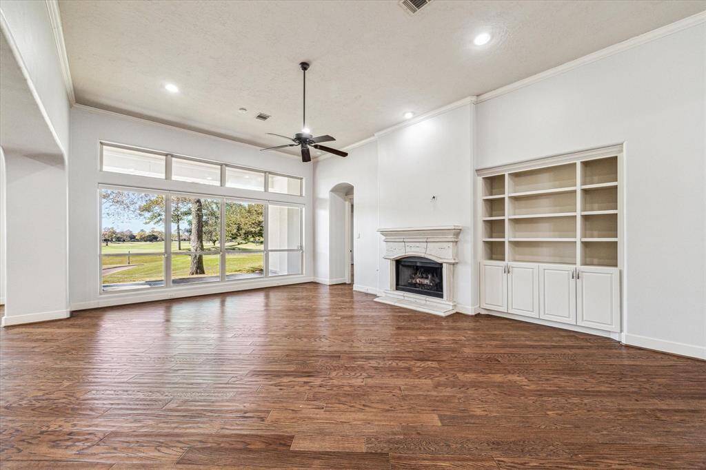 Hardwood floors, recessed lights and crown molding can be found throughout the home.
