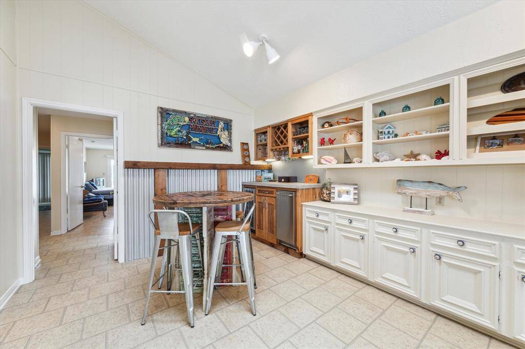 What a fun spot to grab your evening beverage or play a round of cards! The wine frig and Scotsman ice maker enhance the space.