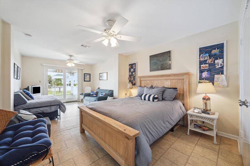 And the third bedroom on the main floor mirrors the size of the first, again with it's own entrance to the back deck area. With three separate decks, there's more than ample room for everyone to find their favorite hang out spot!