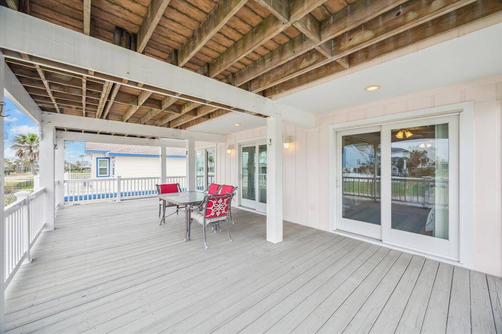 Look how large this deck is - accessible from all three secondary bedrooms on the main floor.  Another wonderful place to watch the sunset or to gather for naps in the hammock or games with friends and family.