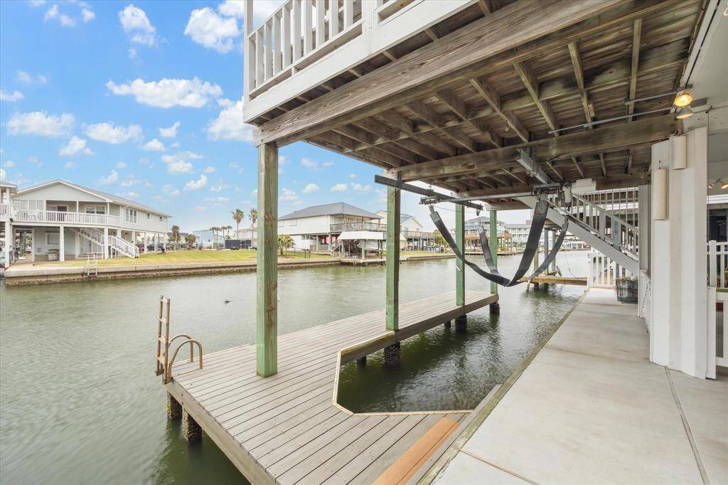 Your bulkhead has been totally replaced!  That's huge!  And the recently painted boat slip is just waiting for you to add your boat for water fun!  The safety fencing on the right slides up and down with a pulley system for access to the waterfront area.