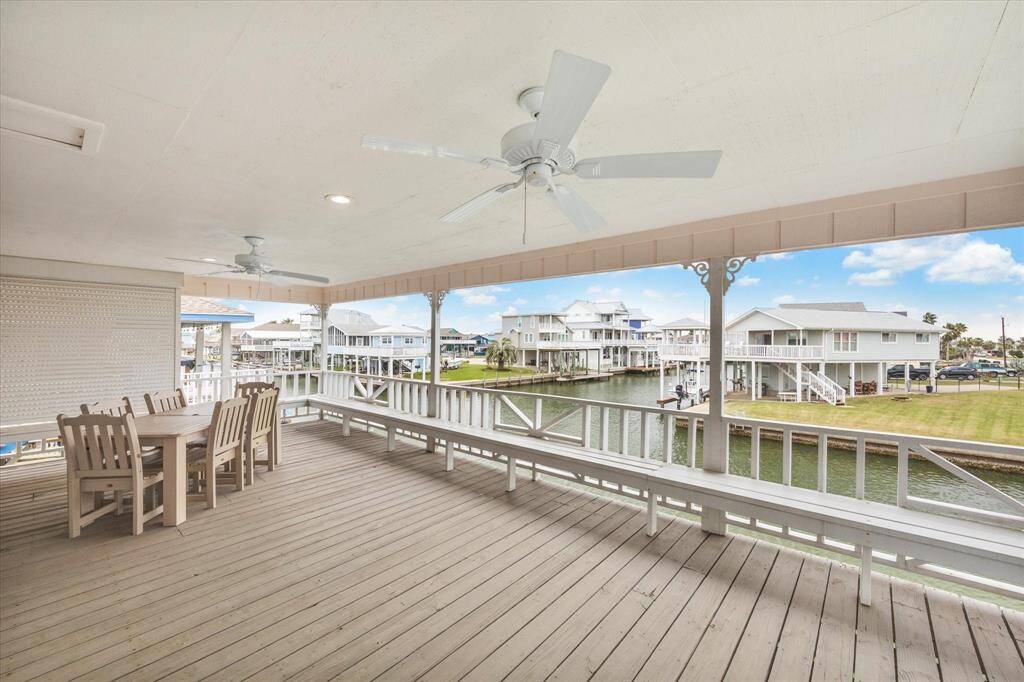 Heading upstairs, you find yourself on this oversized covered deck.  The perfect place to enjoy morning coffee and watch the sunrise!