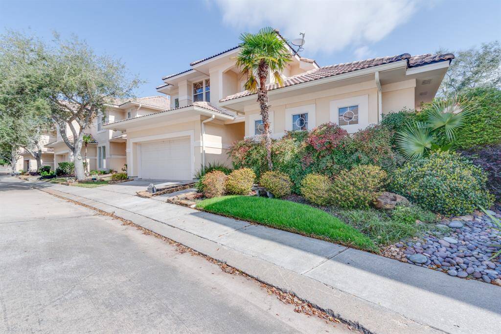 Welcome home to 403 Harborside Way. A mediterranean style home with tropical landscape.