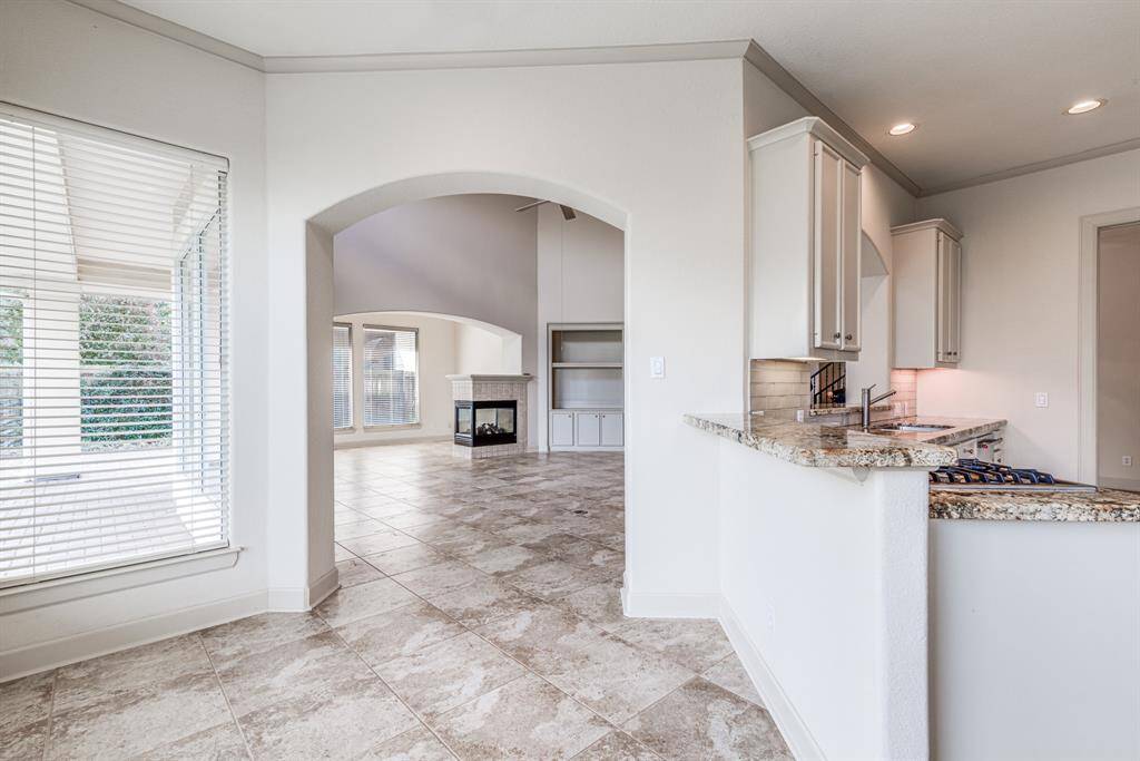 This kitchen boasts two breakfast bar areas, great for entertaining. Open to living space and easy access to back patio area for grilling out or enjoying a morning coffee.