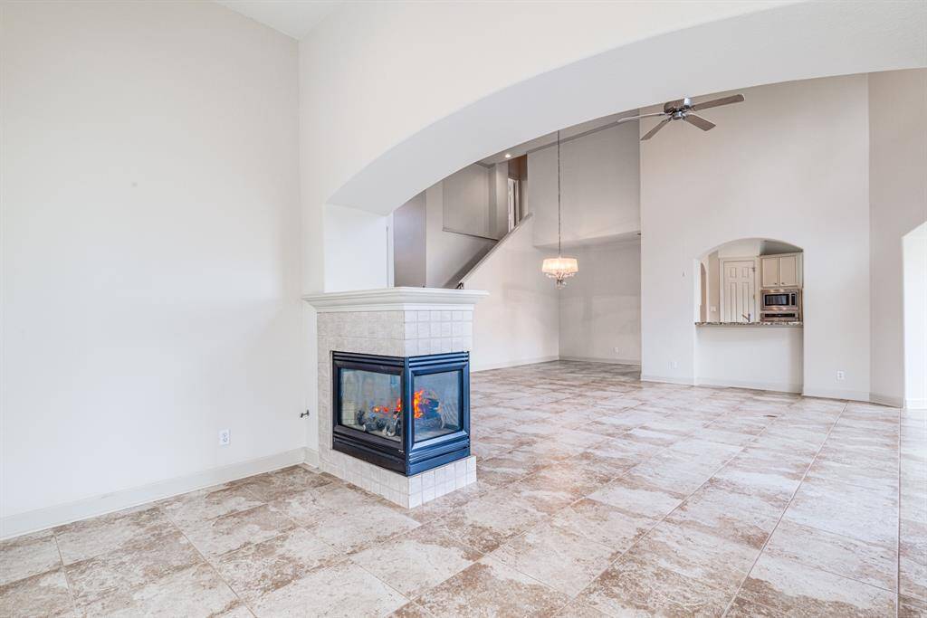 Enjoy this cozy fireplace from two areas in this spacious open living area. Neutrally decorated to a high standard throughout.