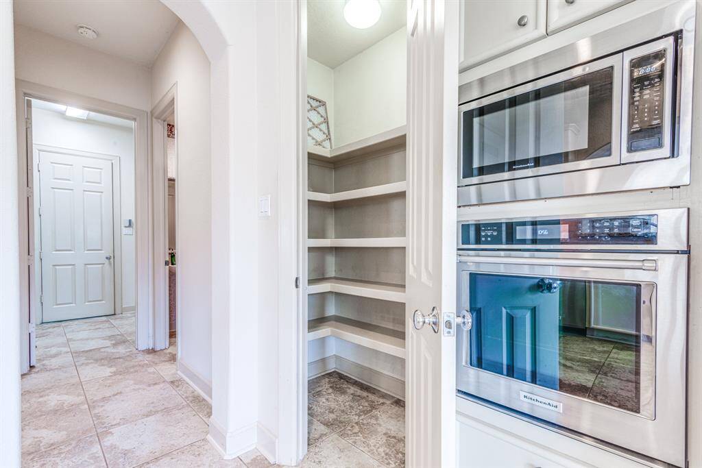 Large pantry and access to powder room, mud room and garage.
