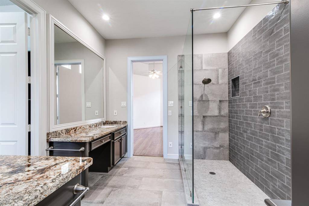 Enjoy this gorgeous custom shower in the primary en suite.