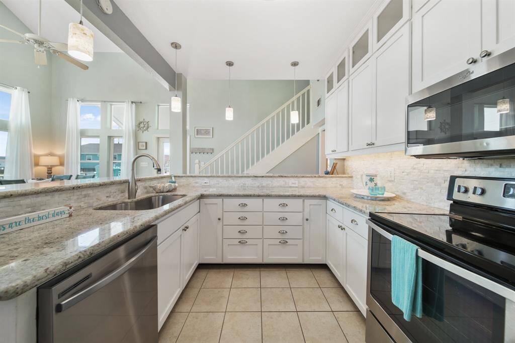 Located just a short walk or golf cart (comes with home!) ride to the beach! Make this dreamy beach house yours today!