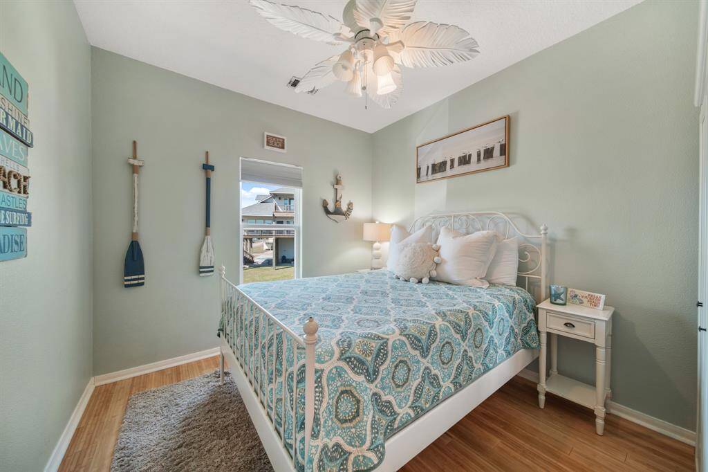 Comfortable and stylish secondary bedroom for family and guests to relax after a fun day at the beach.