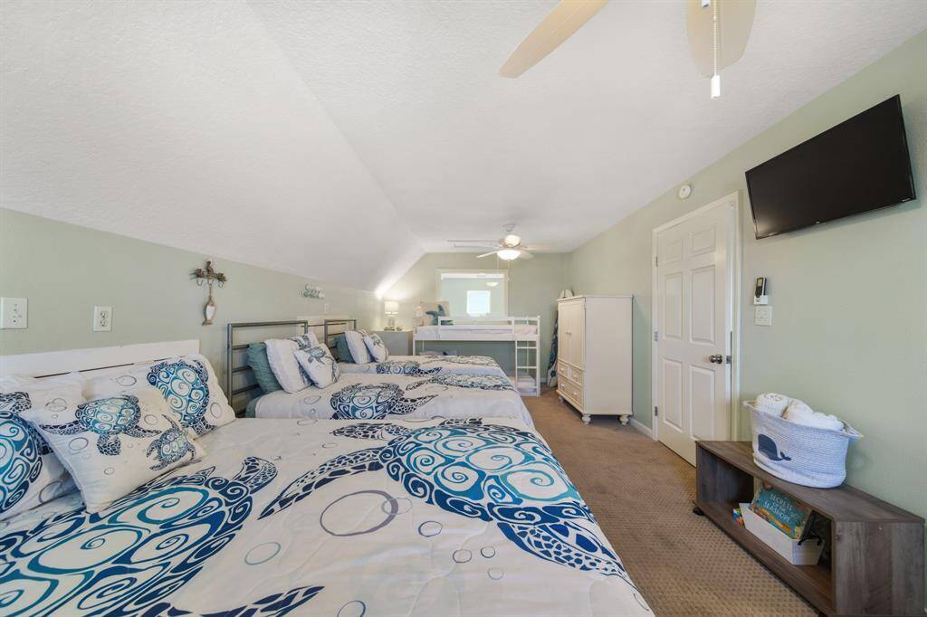 Another comfortable and stylish secondary bedroom for family and guests to relax after a fun day at the beach.